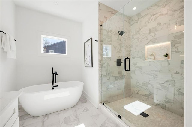 full bath with a marble finish shower, baseboards, a freestanding bath, recessed lighting, and marble finish floor