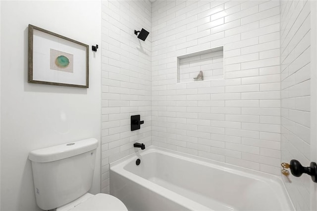 bathroom with toilet and bathing tub / shower combination