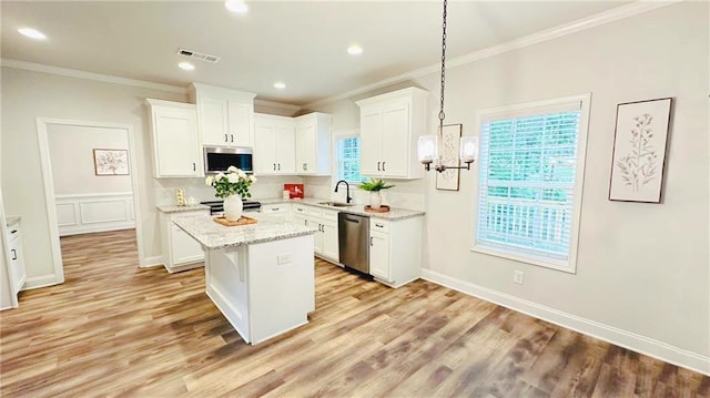 1540 Ox Bridge Ct, Lawrenceville, GA 30043 - kitchen with stainless steel appliances, crown molding, a center island, white cabinetry, and a sink