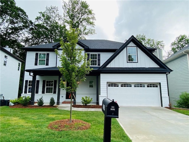 1540 Ox Bridge Ct, Lawrenceville, GA 30043 - view of front of home featuring a front yard, driveway, and board and batten siding