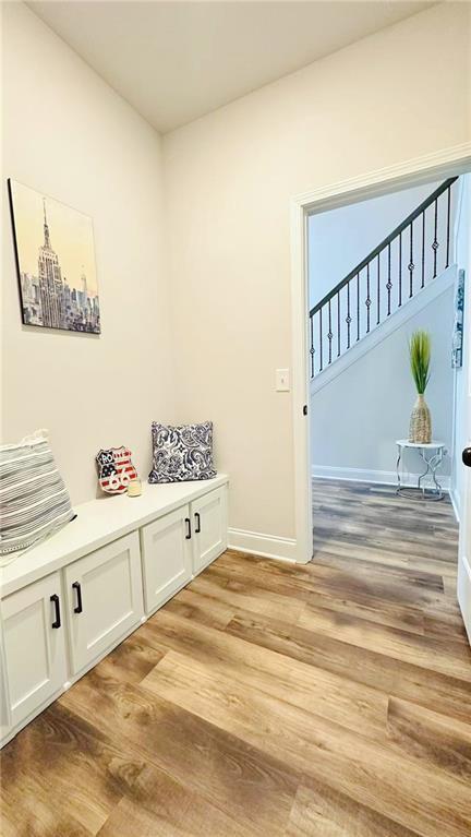 1540 Ox Bridge Ct, Lawrenceville, GA 30043 - mudroom with light wood-type flooring and baseboards