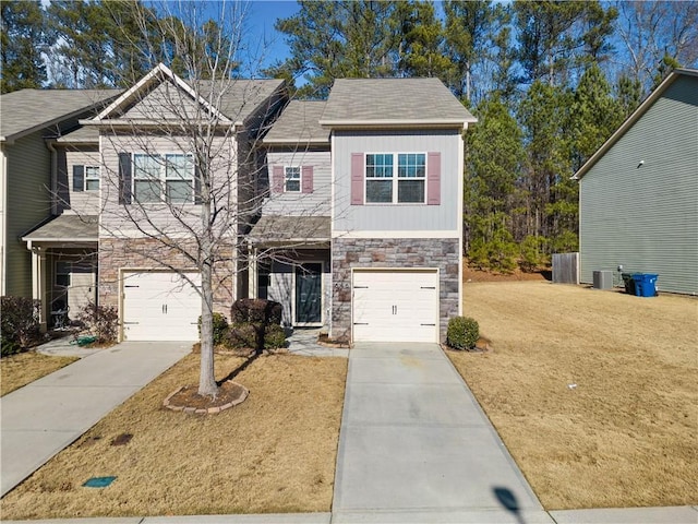 view of front of house featuring a garage and a front lawn