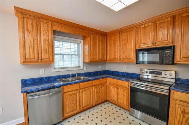 kitchen with appliances with stainless steel finishes and sink