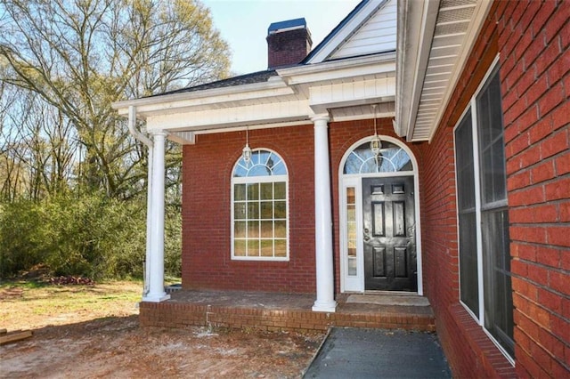 property entrance featuring covered porch