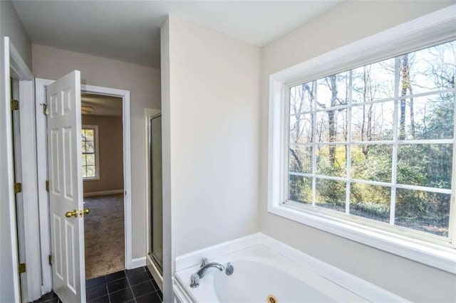 bathroom with plenty of natural light, independent shower and bath, and tile patterned flooring