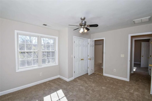 unfurnished bedroom featuring carpet, ceiling fan, and a closet