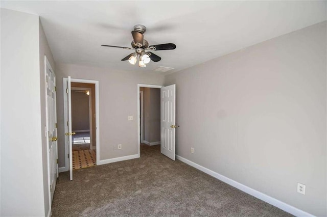 unfurnished bedroom with ceiling fan and carpet