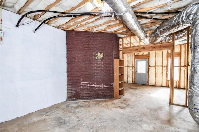 basement with brick wall