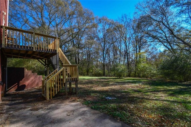 view of yard with a wooden deck