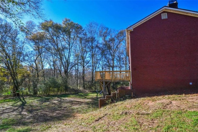 view of yard with a wooden deck