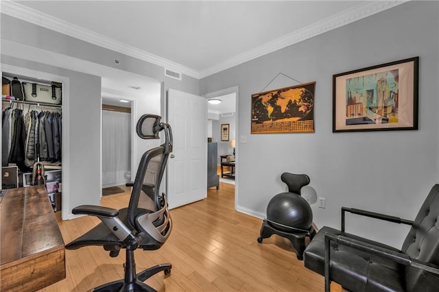 199 14th St NE Unit 2010, Atlanta, GA 30309 - workout room featuring baseboards, light wood-type flooring, visible vents, and crown molding