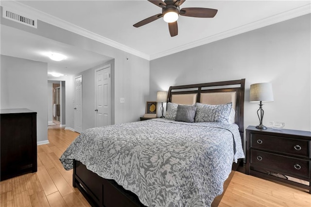 199 14th St NE Unit 2010, Atlanta, GA 30309 - bedroom with visible vents, baseboards, a ceiling fan, light wood-style flooring, and ornamental molding