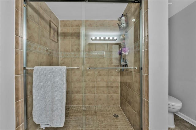 199 14th St NE Unit 2010, Atlanta, GA 30309 - full bathroom featuring a stall shower and toilet