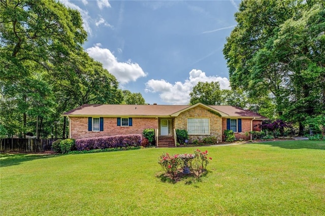 1850 Francis Rd SW, Conyers, GA 30094 - ranch-style house with brick siding, fence, and a front yard