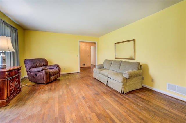 1850 Francis Rd SW, Conyers, GA 30094 - living room featuring visible vents, baseboards, and wood finished floors
