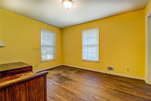 1850 Francis Rd SW, Conyers, GA 30094 - interior space with baseboards, dark wood-type flooring, and visible vents