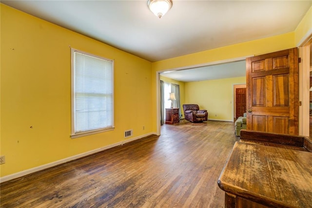 1850 Francis Rd SW, Conyers, GA 30094 - living room featuring visible vents, baseboards, and wood finished floors
