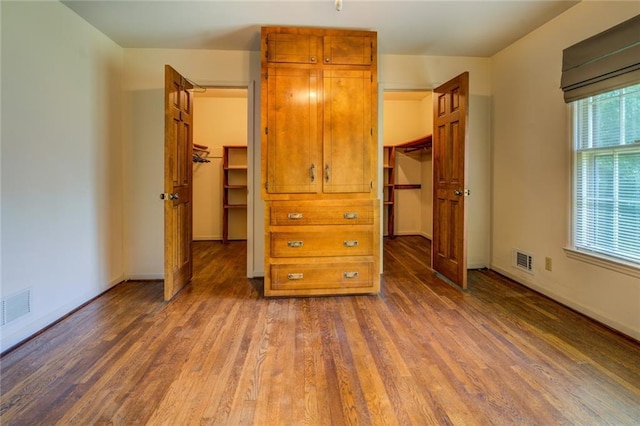 1850 Francis Rd SW, Conyers, GA 30094 - bedroom featuring visible vents, a closet, wood finished floors, and a spacious closet