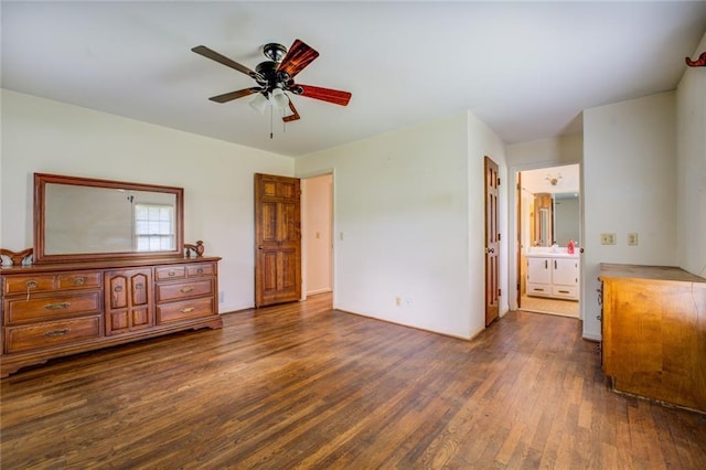 1850 Francis Rd SW, Conyers, GA 30094 - bedroom with dark wood-type flooring, ensuite bathroom, and ceiling fan