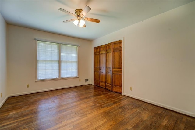 1850 Francis Rd SW, Conyers, GA 30094 - unfurnished bedroom with visible vents, a closet, wood finished floors, baseboards, and a ceiling fan