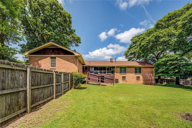 1850 Francis Rd SW, Conyers, GA 30094 - rear view of house featuring a fenced backyard, a yard, and brick siding