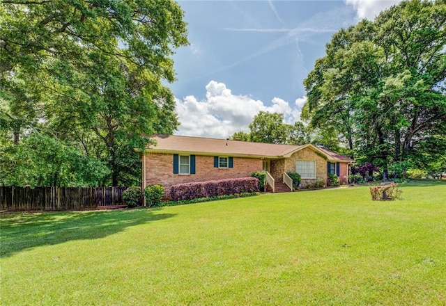 1850 Francis Rd SW, Conyers, GA 30094 - ranch-style home featuring brick siding, fence, and a front yard
