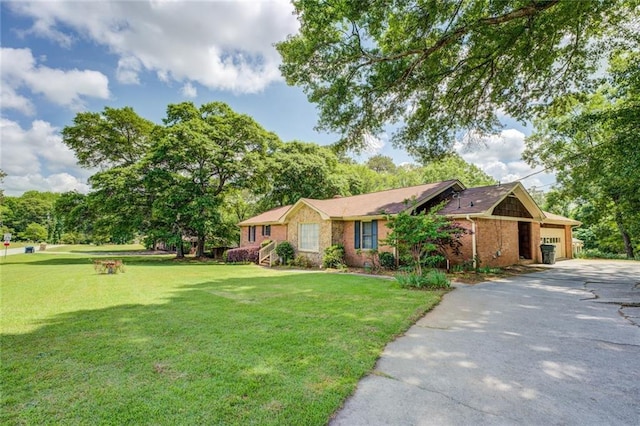 1850 Francis Rd SW, Conyers, GA 30094 - ranch-style house with brick siding, a garage, driveway, and a front yard