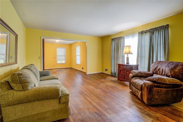 1850 Francis Rd SW, Conyers, GA 30094 - living area with baseboards, visible vents, and wood finished floors