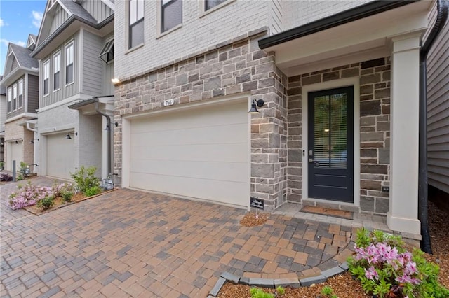 doorway to property featuring a garage