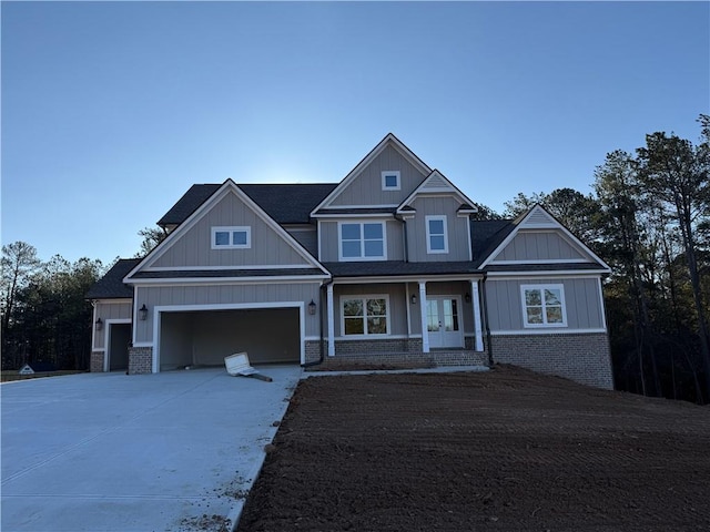 craftsman-style home featuring a porch and a garage