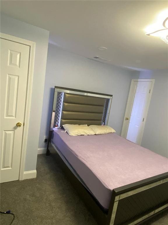 4520 Essen Ln, Cumming, GA 30041 - bedroom featuring dark colored carpet and baseboards