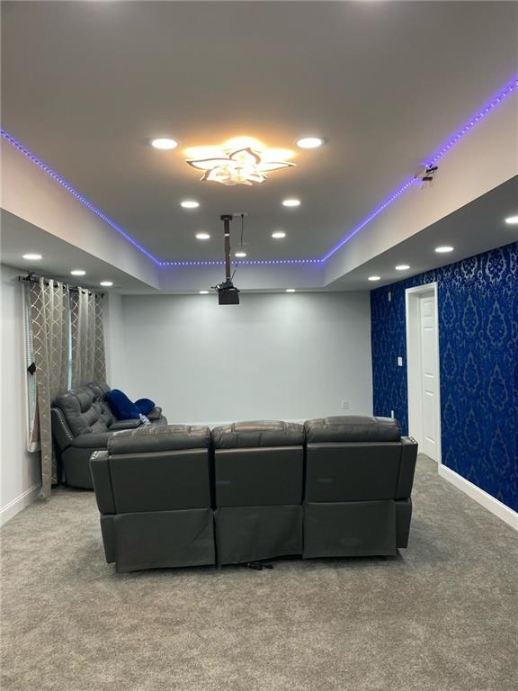 4520 Essen Ln, Cumming, GA 30041 - carpeted home theater room featuring a tray ceiling, recessed lighting, baseboards, and wallpapered walls