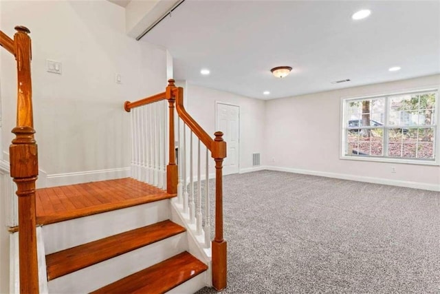 stairs with carpet floors