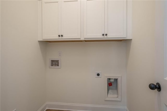 laundry area featuring cabinet space, hookup for an electric dryer, and washer hookup