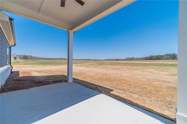 view of yard with a patio and a ceiling fan