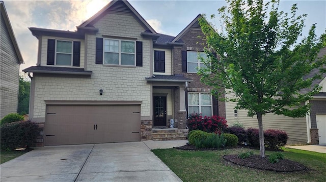 craftsman house featuring stone siding, concrete driveway, and an attached garage