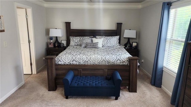 bedroom with baseboards, ornamental molding, and light colored carpet