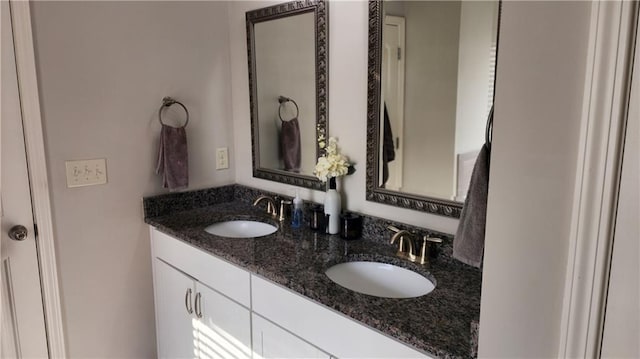 bathroom featuring double vanity and a sink
