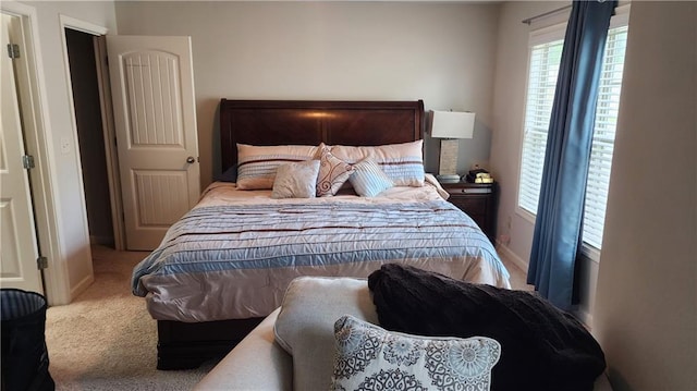 bedroom with carpet flooring and baseboards
