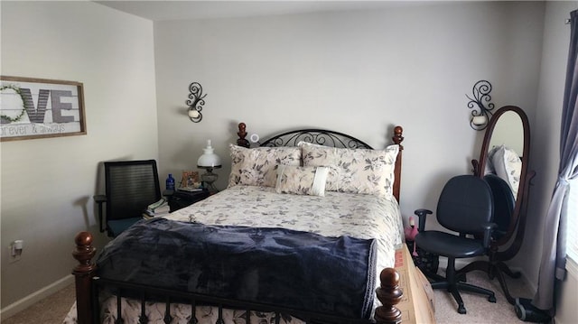 bedroom with carpet and baseboards