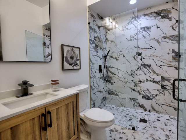 bathroom with vanity, toilet, and walk in shower