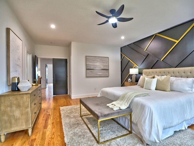 bedroom featuring ceiling fan and light wood-type flooring