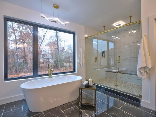 bathroom with plenty of natural light and independent shower and bath