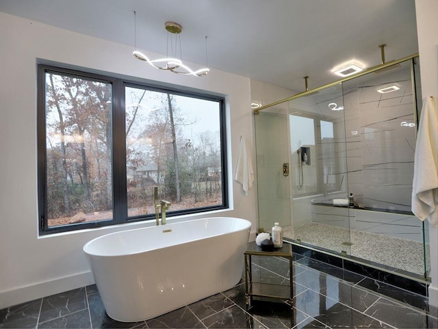 bathroom featuring independent shower and bath