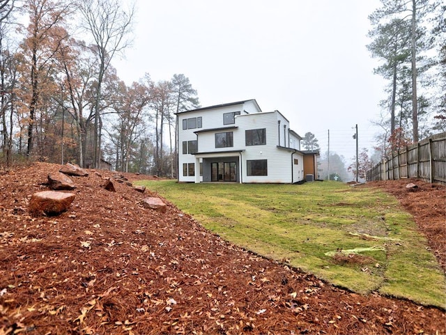 rear view of house with a lawn