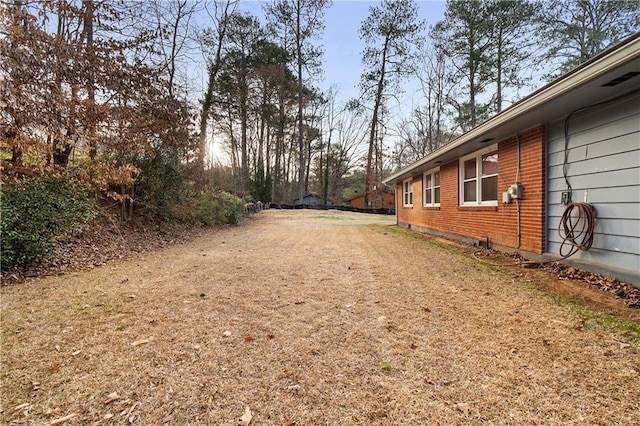 view of street featuring dirt driveway