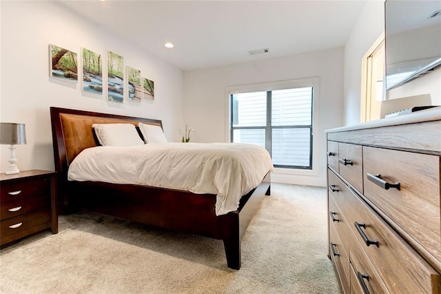 bedroom featuring light colored carpet