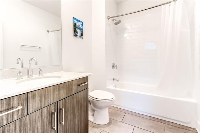 full bathroom with tile patterned floors, toilet, vanity, and shower / tub combo