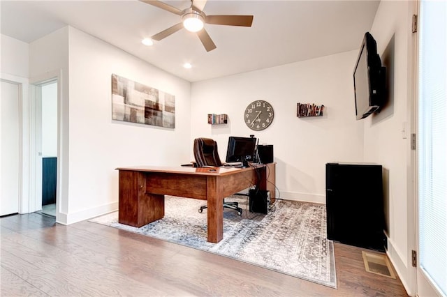 home office featuring ceiling fan and wood-type flooring