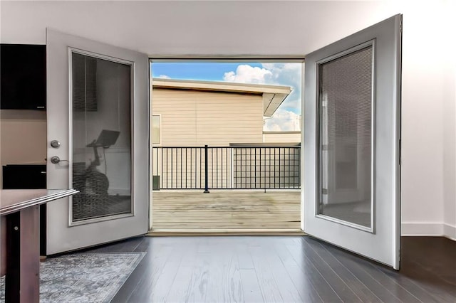 entryway with dark wood-type flooring